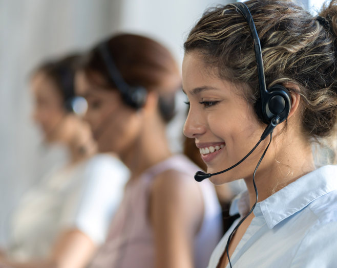 Call Center employees, smiling with headset on